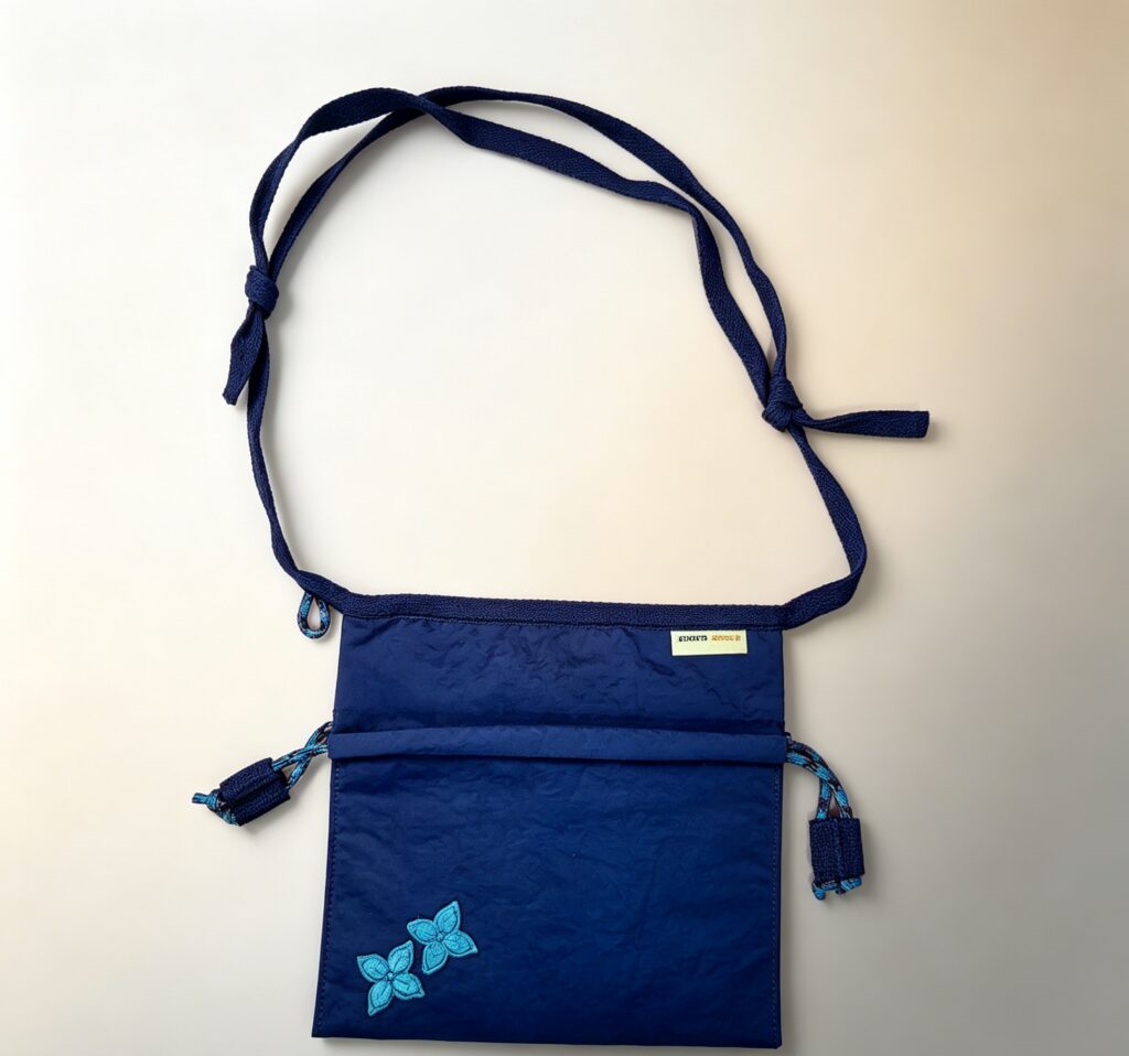 Hand-stitched floral mobile phone pouch
